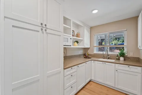 a kitchen with a sink and cabinets
