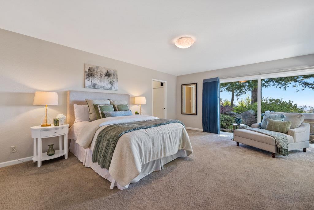 33 Aqua View Drive Watsonville, CA 95076 - Photo 19 of 51 a spacious bedroom with a bed and a large window