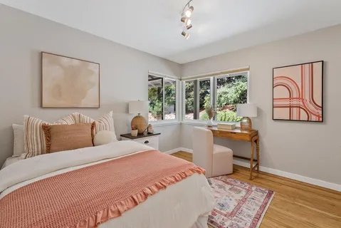 a bedroom with a bed and window