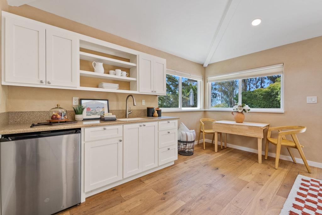 33 Aqua View Drive Watsonville, CA 95076 - Photo 29 of 51 a living room with furniture a rug kitchen view and large windows