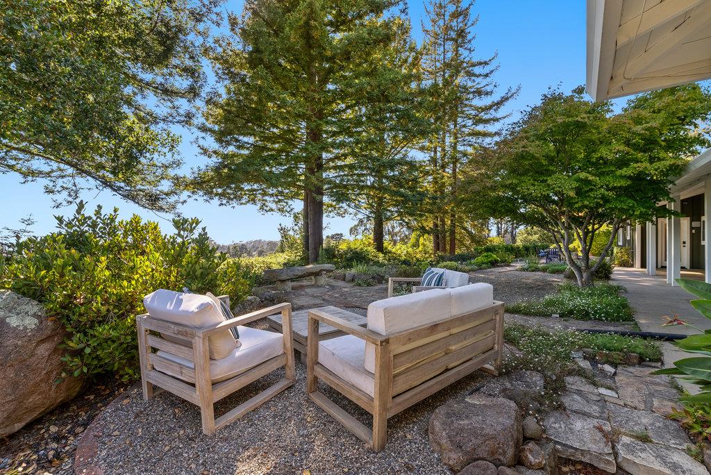 33 Aqua View Drive Watsonville, CA 95076 - Photo 33 of 51 a view of a garden with lawn chairs and a fire pit
