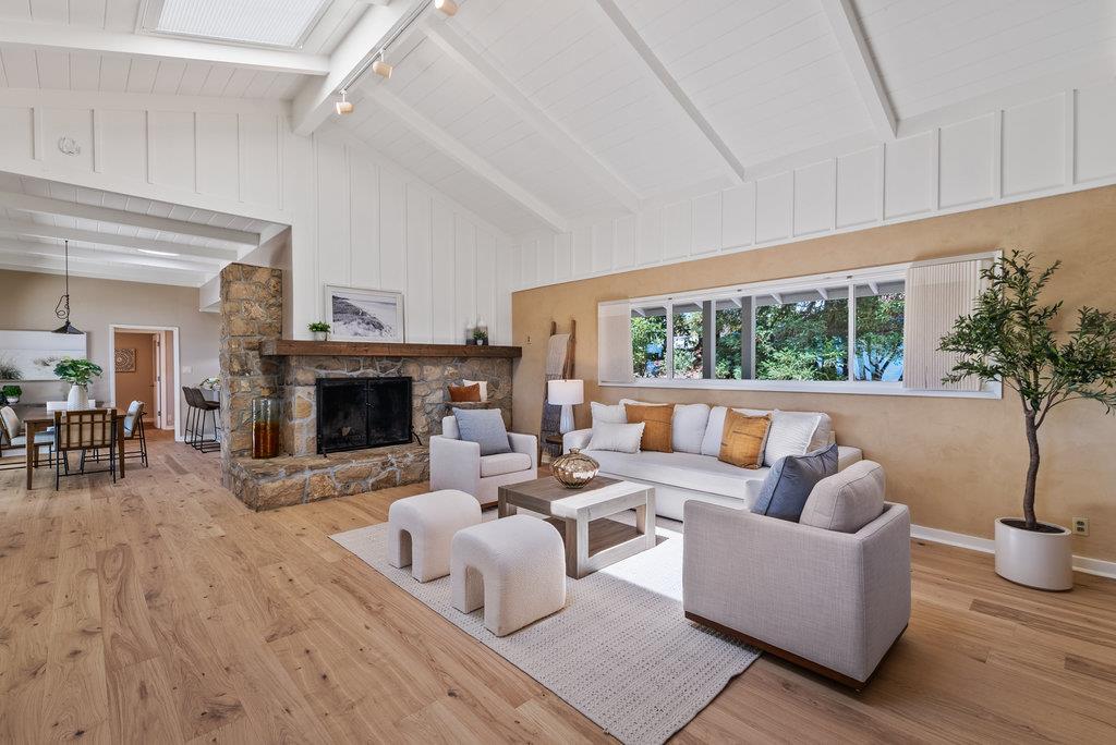 33 Aqua View Drive Watsonville, CA 95076 - Photo 4 of 51 a living room with furniture a fireplace and a potted plant