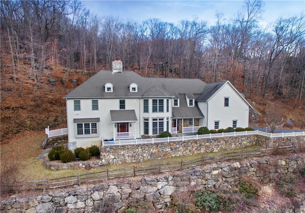 77 Ledges Road Ridgefield, CT 06877 - Photo 1 of 1 a front view of a house with a yard
