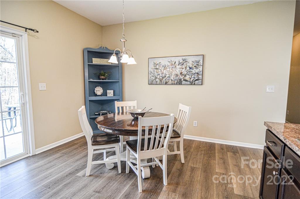 1617 Beleek Ridge Lane Clover, SC 29710 - Photo 11 of 22 a view of a dining room with furniture and wooden floor