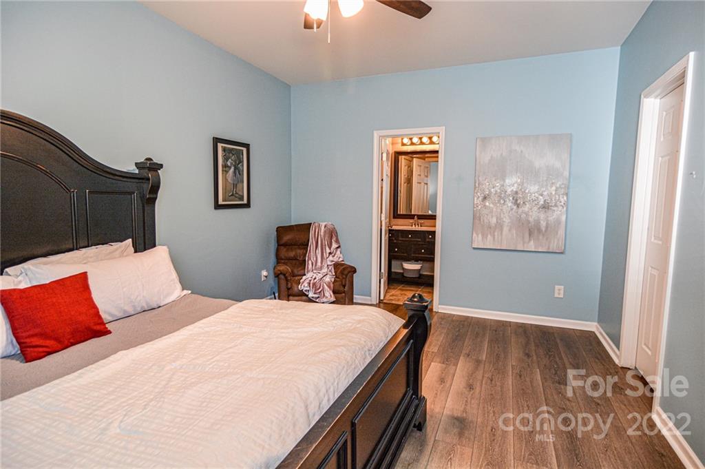 1617 Beleek Ridge Lane Clover, SC 29710 - Photo 18 of 22 a bedroom with a bed and wooden floor