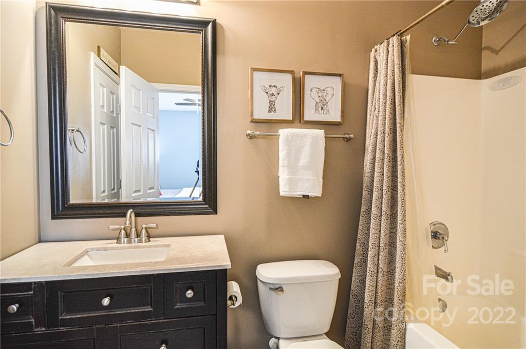 1617 Beleek Ridge Lane Clover, SC 29710 - Photo 19 of 22 a bathroom with a toilet a sink and mirror