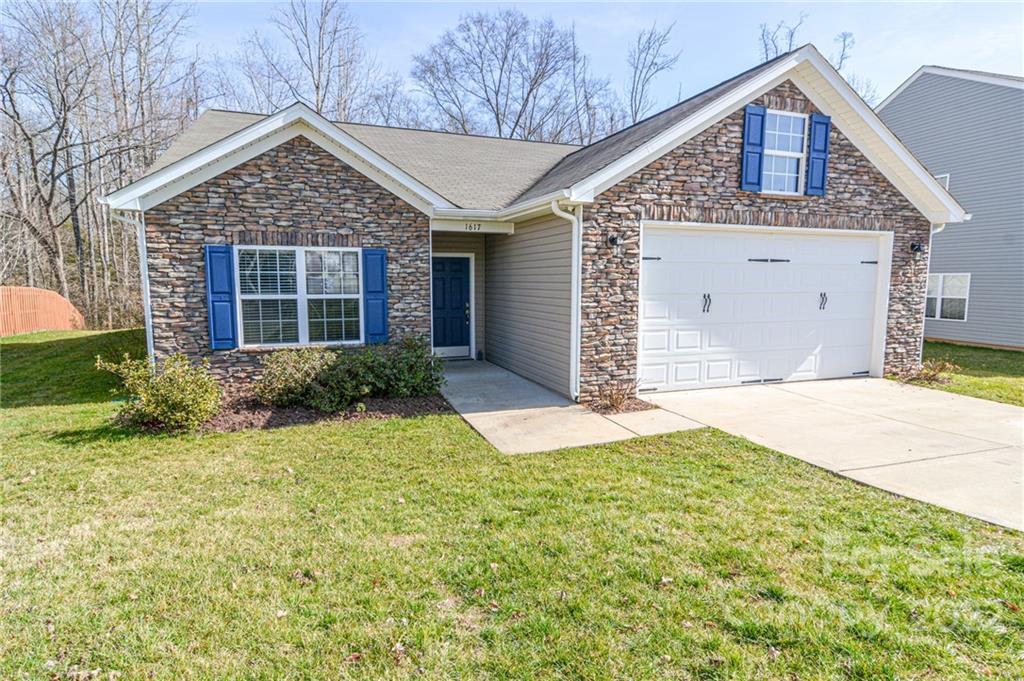 1617 Beleek Ridge Lane Clover, SC 29710 - Photo 2 of 22 a front view of a house with garden