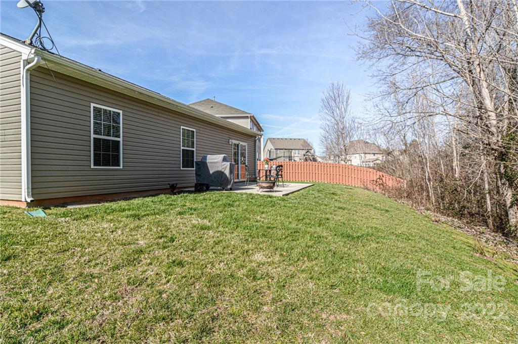 1617 Beleek Ridge Lane Clover, SC 29710 - Photo 21 of 22 a backyard of a house with table and chairs