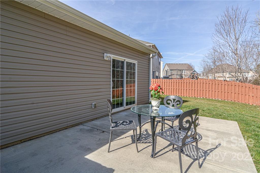 1617 Beleek Ridge Lane Clover, SC 29710 - Photo 22 of 22 a backyard of a house with table and chairs