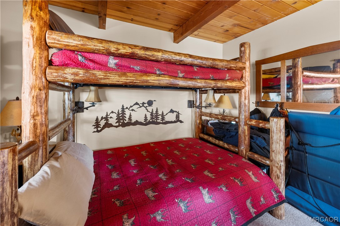 1289 Canyon Road Fawnskin, CA 92333 - Photo 15 of 23 a bed room with a bed and a window