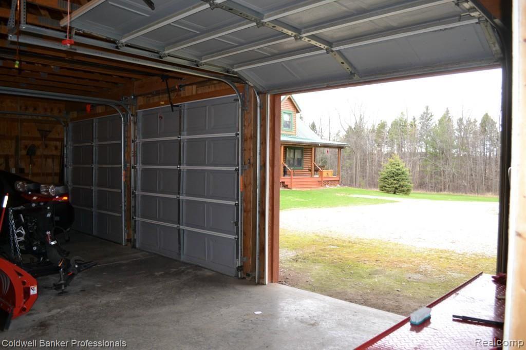 4739 Skelton Road Columbiaville, MI 48421 - Photo 35 of 36 3 Car Garage for storing lots of toys.