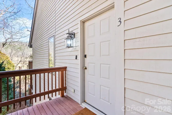 a view of a balcony with wooden floor