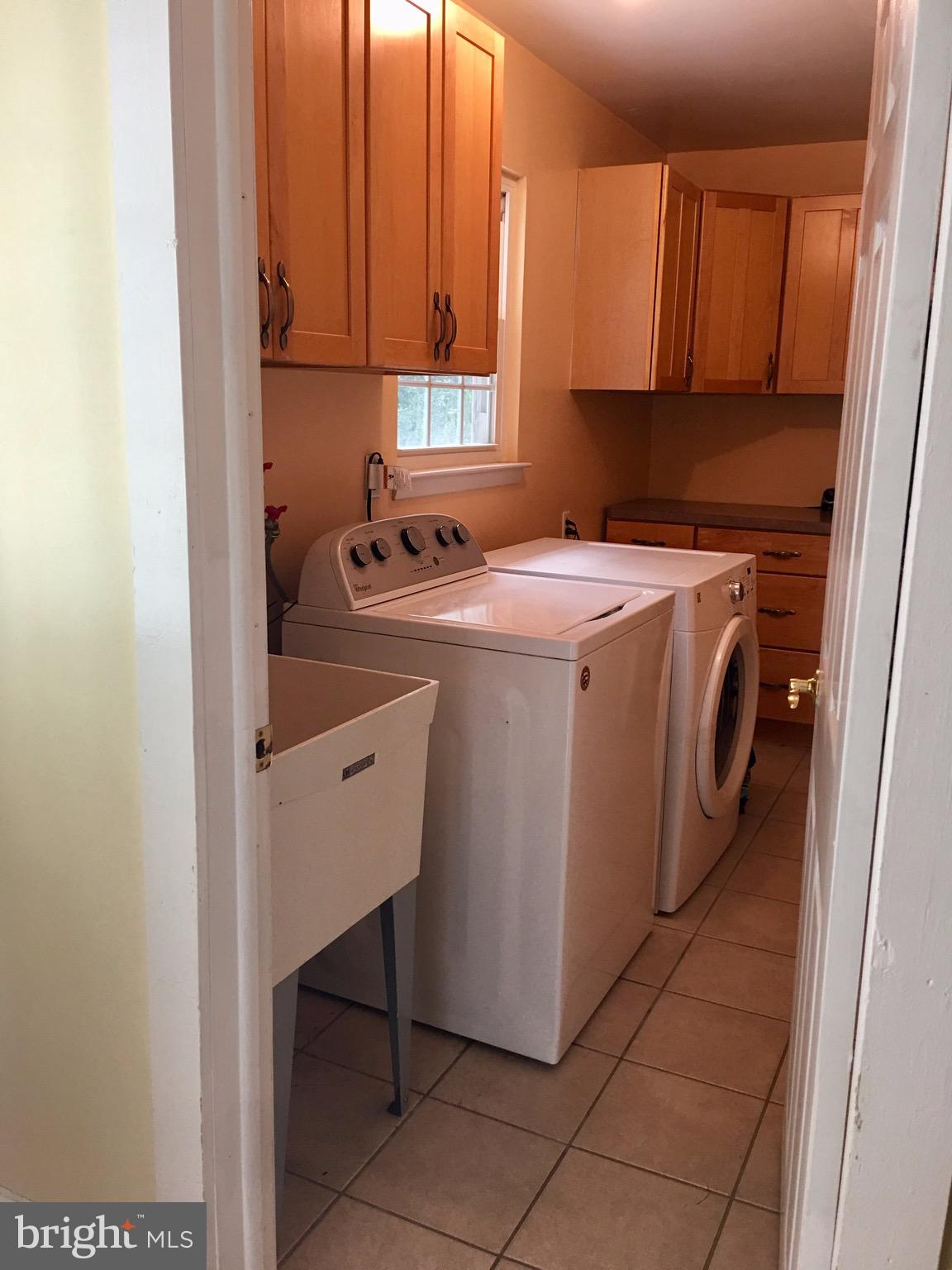 1236 Cushmore Road Southampton, PA 18966 - Photo 11 of 23 Laundry room with tile floor, cabinets for storage