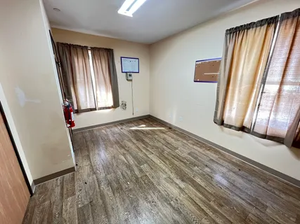 a bathroom with a toilet and a mirror