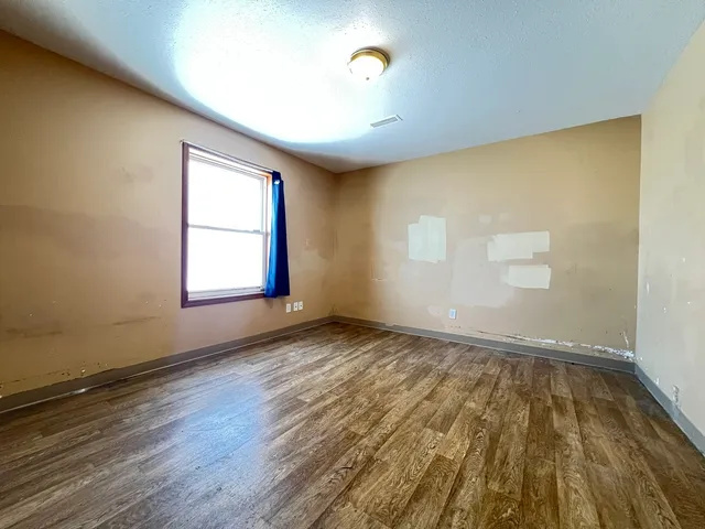 a bathroom with a toilet sink and shower