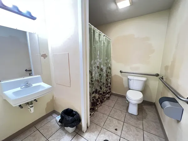 a bathroom with a sink and a shower