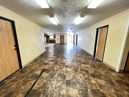 a view of a livingroom with furniture and a stove