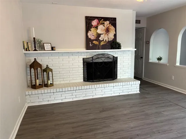 a view of a fireplace with wooden floor