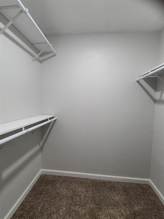 5036 Avery Lane The Colony, TX 75056 - Photo 15 of 22 a view of a room with racks on the wall