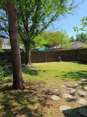 a swimming pool with outdoor seating and yard
