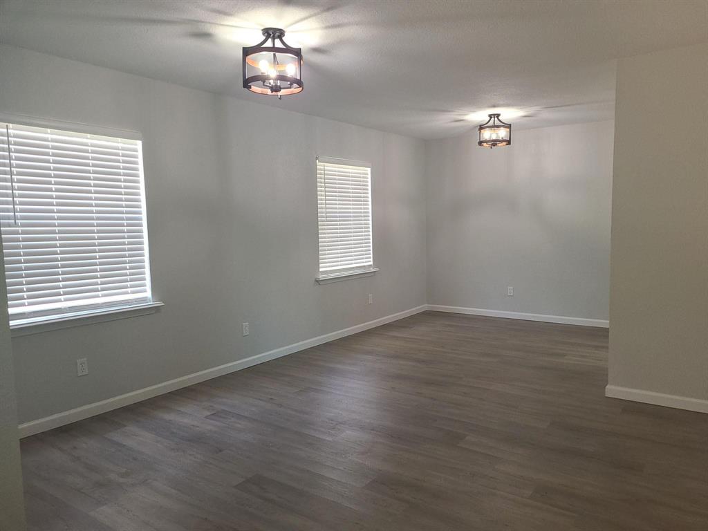 5036 Avery Lane The Colony, TX 75056 - Photo 2 of 22 wooden floor in an empty room with a window
