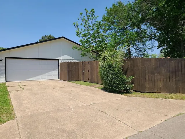 a house with a tree in front of it