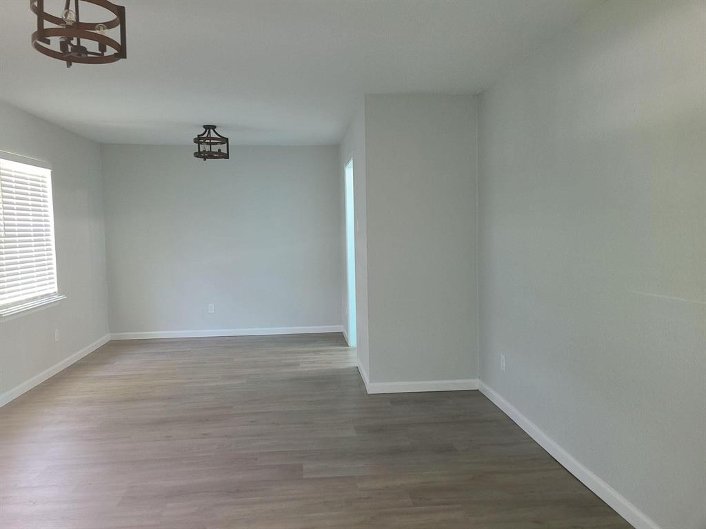 5036 Avery Lane The Colony, TX 75056 - Photo 4 of 22 wooden floor in a empty room