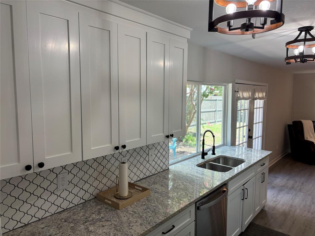5036 Avery Lane The Colony, TX 75056 - Photo 7 of 22 a kitchen with a sink window and cabinets