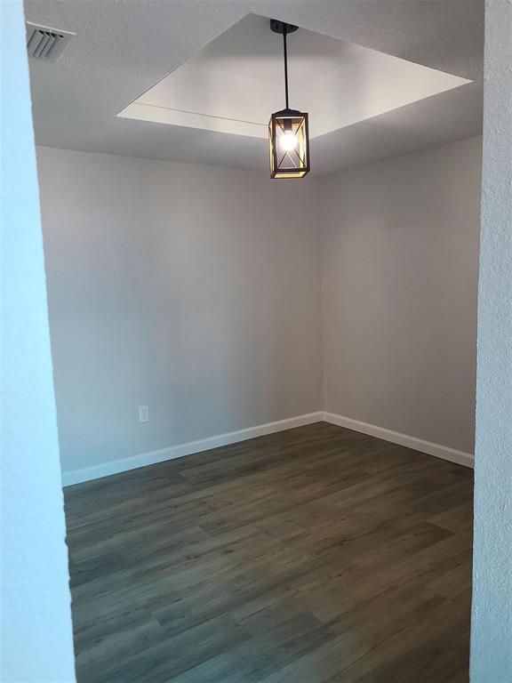 5036 Avery Lane The Colony, TX 75056 - Photo 9 of 22 a view of an empty room with wooden floor