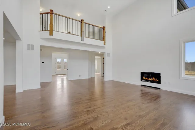a open kitchen with white cabinets and stainless steel appliances