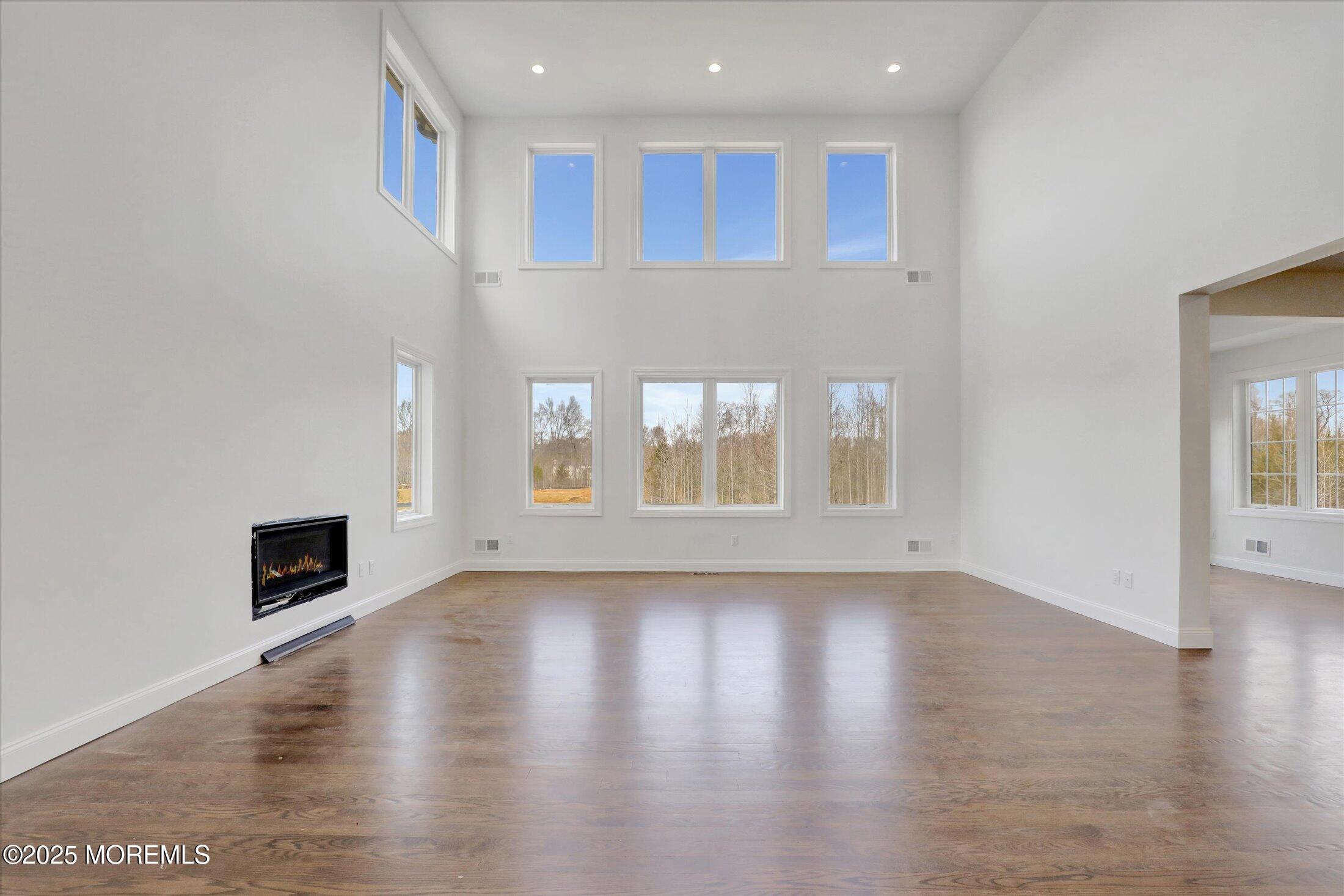 11 Cook Court Millstone Township, NJ 08535 - Photo 15 of 64 a view of an empty room with wooden floor and a window