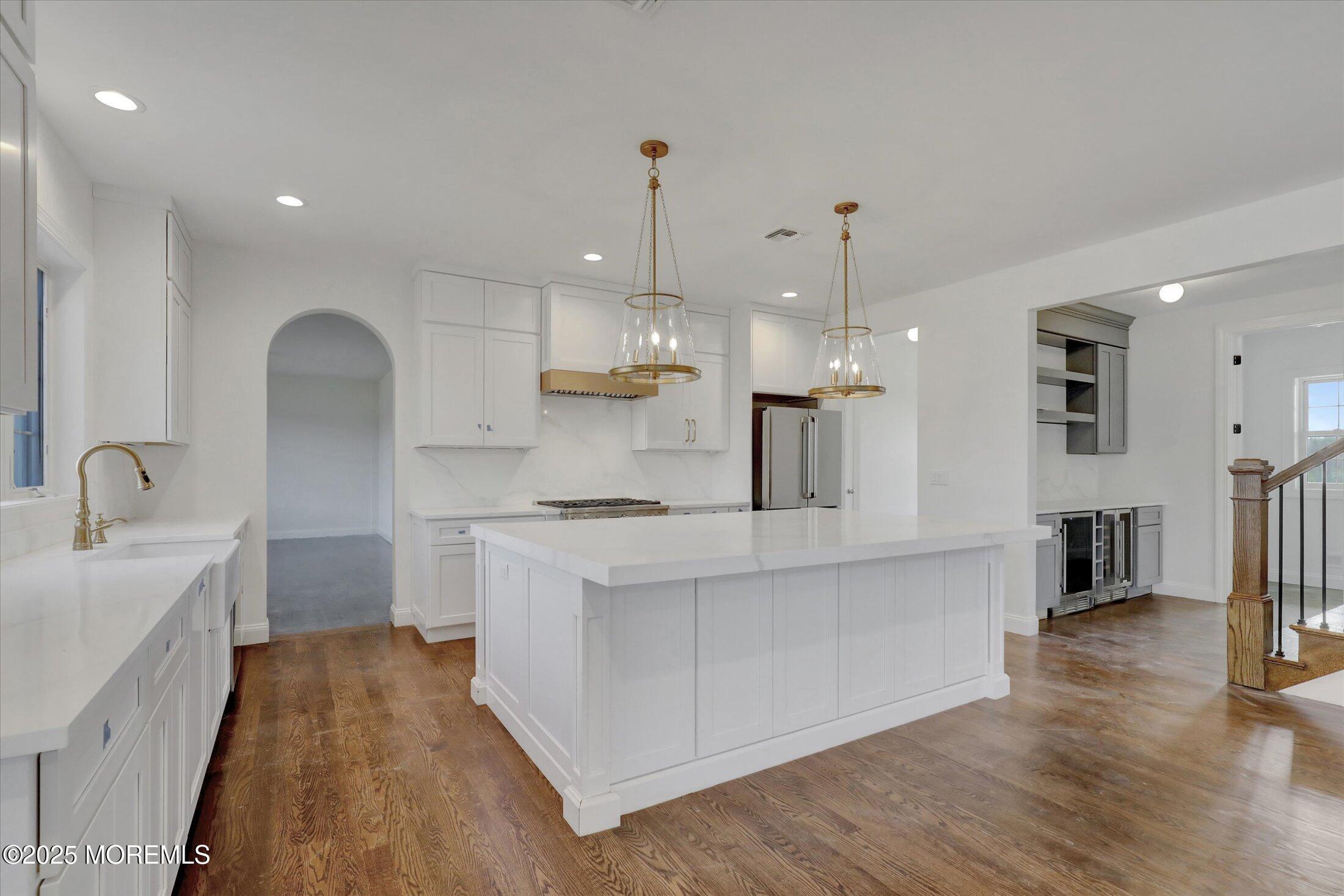 11 Cook Court Millstone Township, NJ 08535 - Photo 24 of 64 a large kitchen with stainless steel appliances kitchen island a stove a sink a refrigerator and a center island