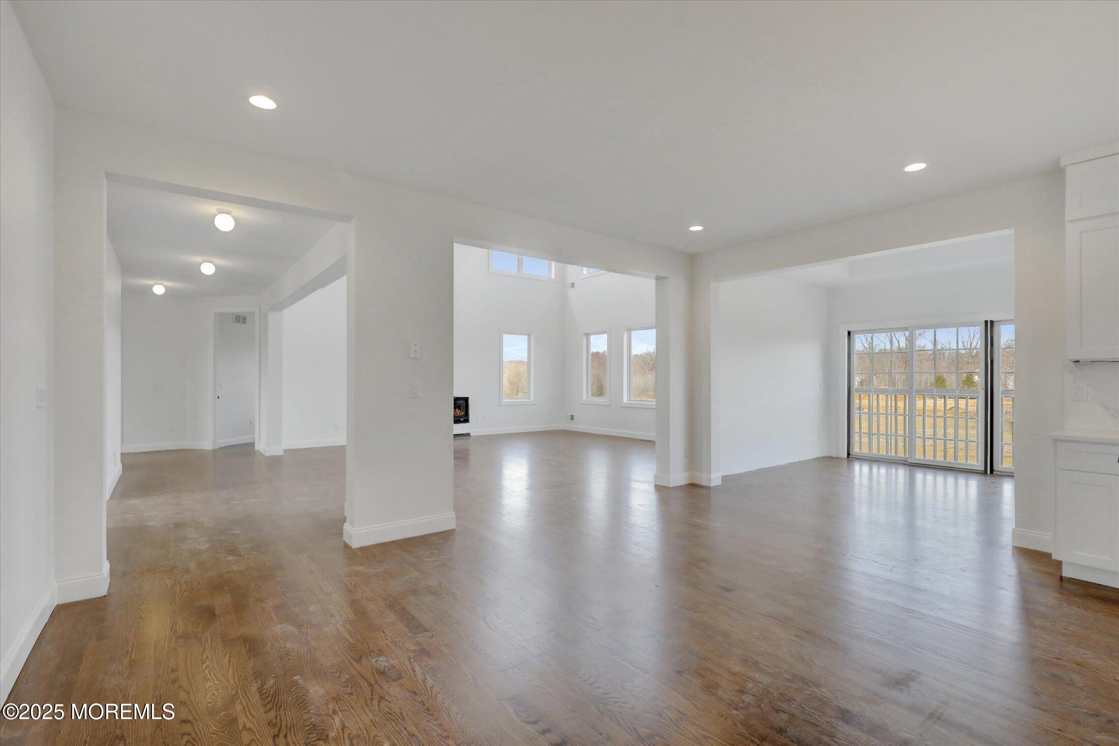 11 Cook Court Millstone Township, NJ 08535 - Photo 28 of 64 a view of an empty room with wooden floor and windows