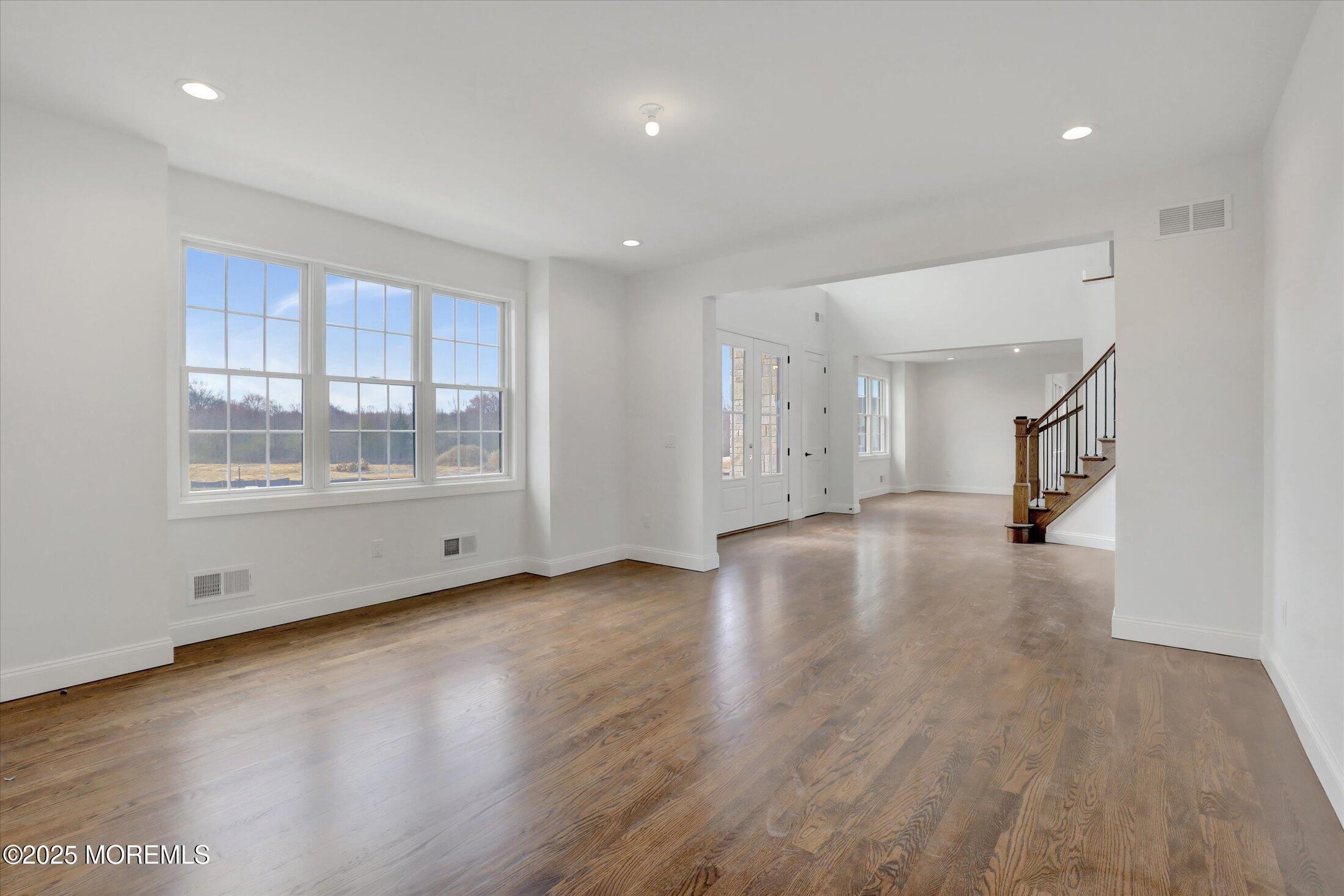 11 Cook Court Millstone Township, NJ 08535 - Photo 33 of 64 a view of empty room with wooden floor and fan