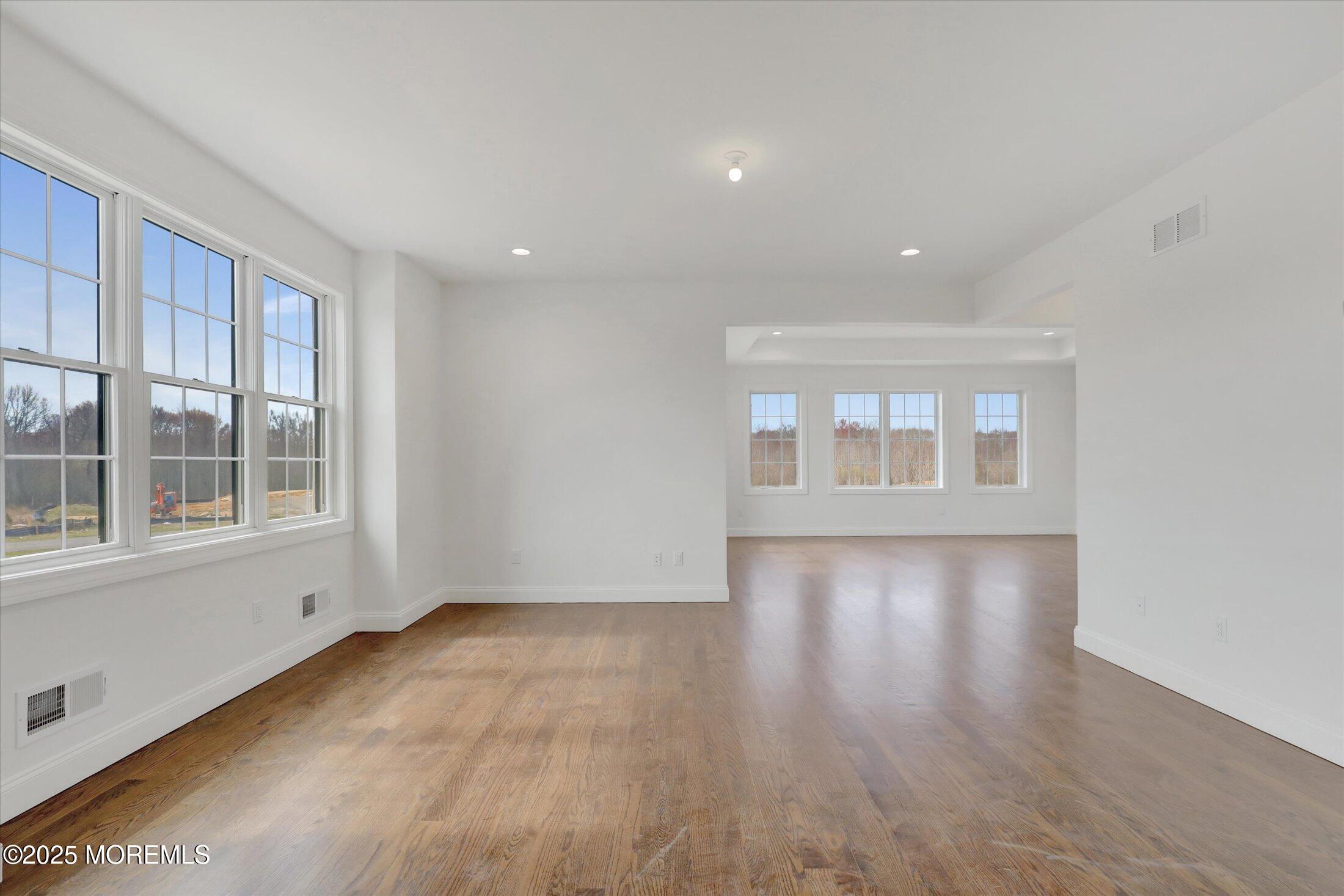 11 Cook Court Millstone Township, NJ 08535 - Photo 34 of 64 an empty room with wooden floor and windows
