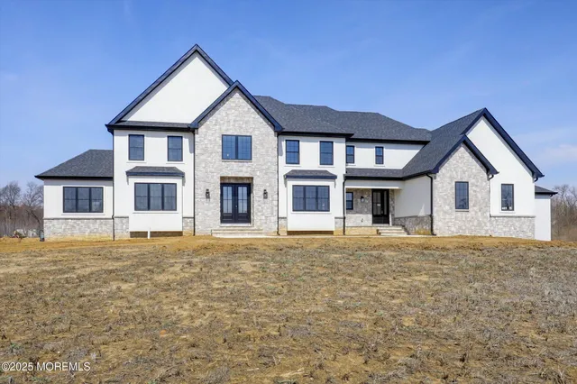 a front view of a house with a yard