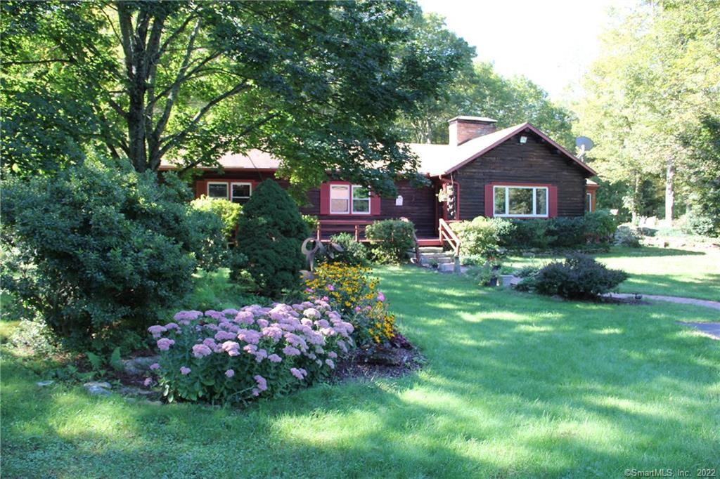 109 Chittenden Road Hebron, CT 06231 - Photo 1 of 1 a front view of a house with a yard and potted plants