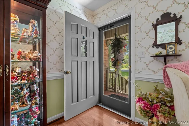 a view of a entryway door of the room