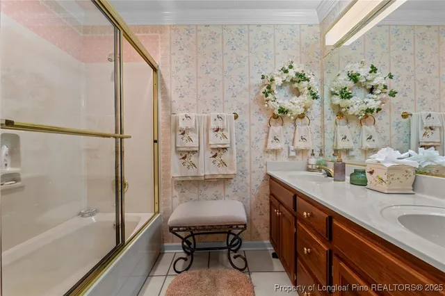 a bathroom with a granite countertop sink a mirror and a shower