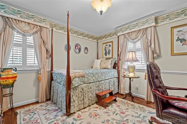 a bedroom with furniture and a window