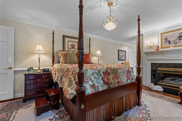 a bedroom with bed and wooden floor
