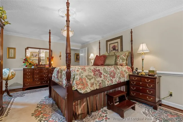 a bed room with a bed window and a dresser