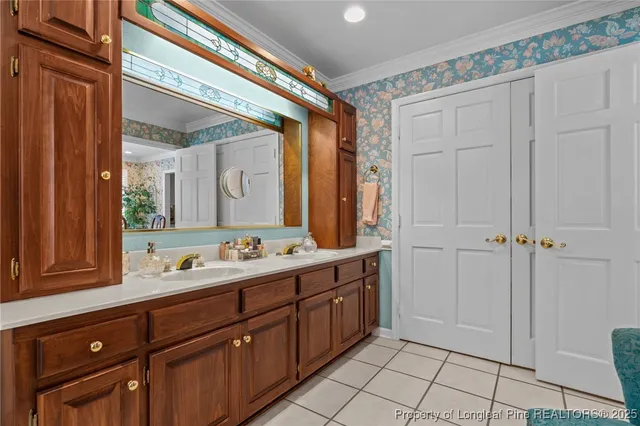 a bathroom with a double vanity sink and mirror