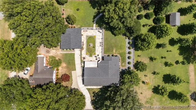 an aerial view of a house with outdoor space