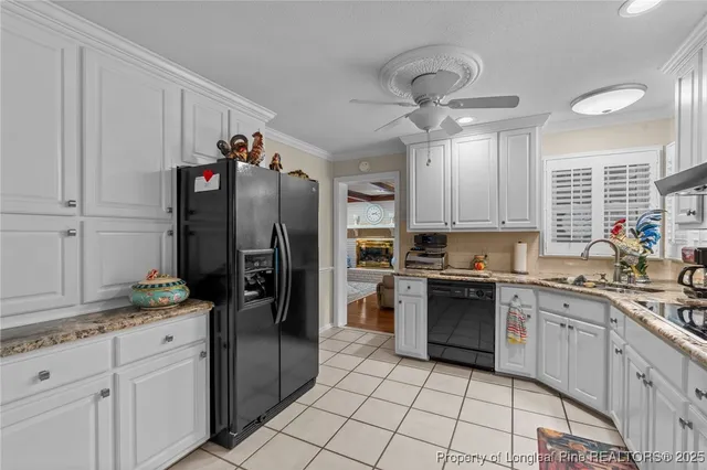 a kitchen with stainless steel appliances granite countertop a refrigerator sink and cabinets