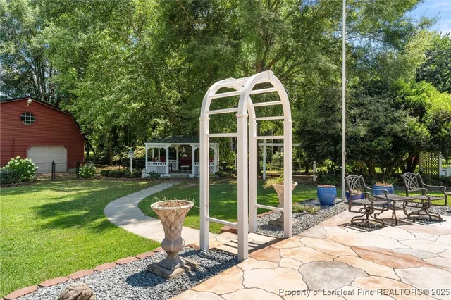 a view of a swimming pool with a patio