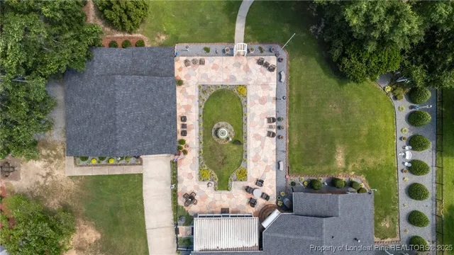 an aerial view of a fireplace with a table and chairs