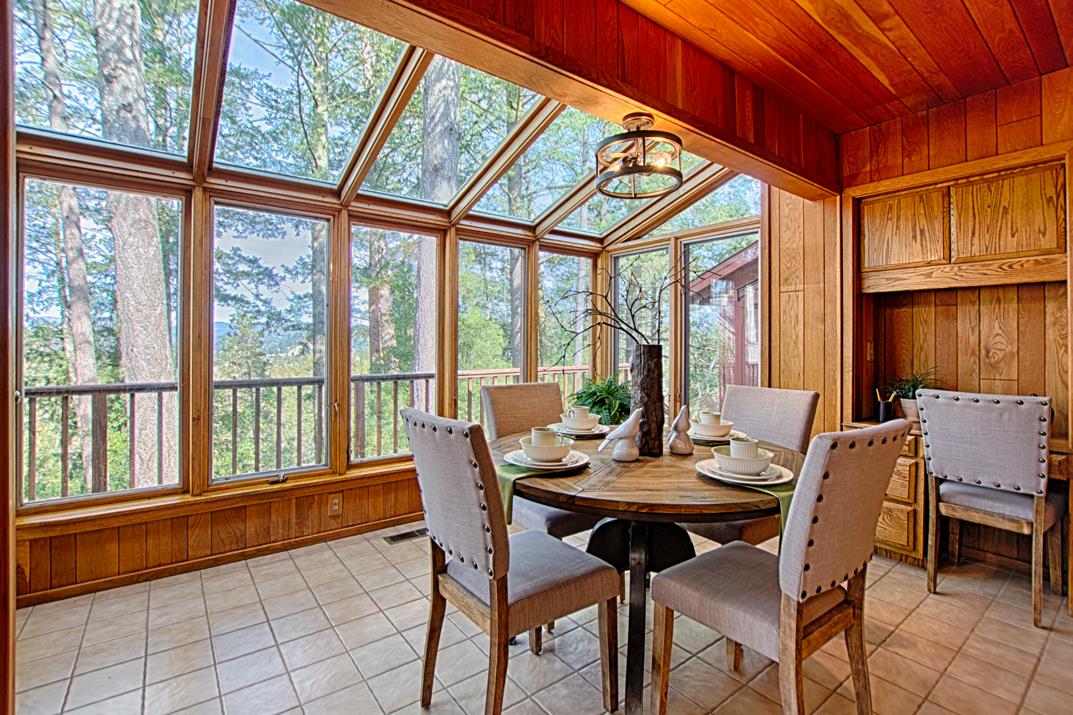 79 Pine Avenue Mount Hermon, CA 95041 - Photo 12 of 32 a view of a dining room with furniture large windows and wooden floor