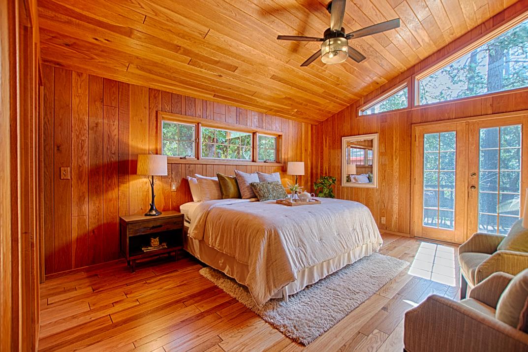 79 Pine Avenue Mount Hermon, CA 95041 - Photo 13 of 32 a bedroom with a bed and glass walk in closet