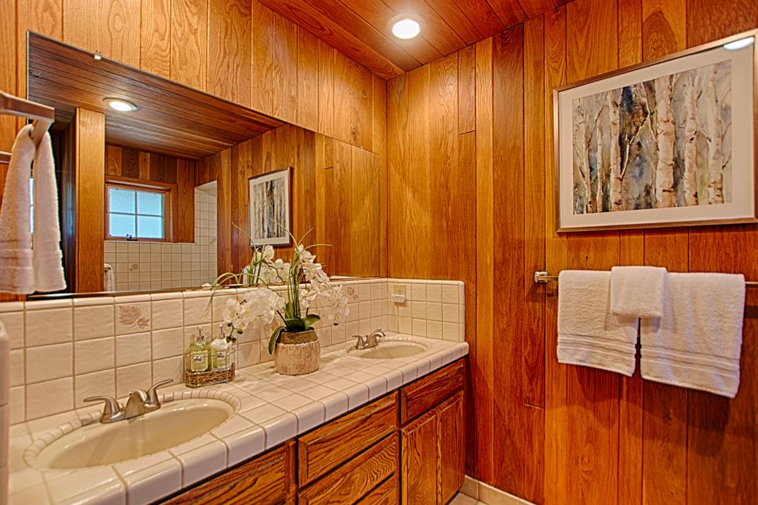 79 Pine Avenue Mount Hermon, CA 95041 - Photo 15 of 32 a bathroom with a sink and a mirror